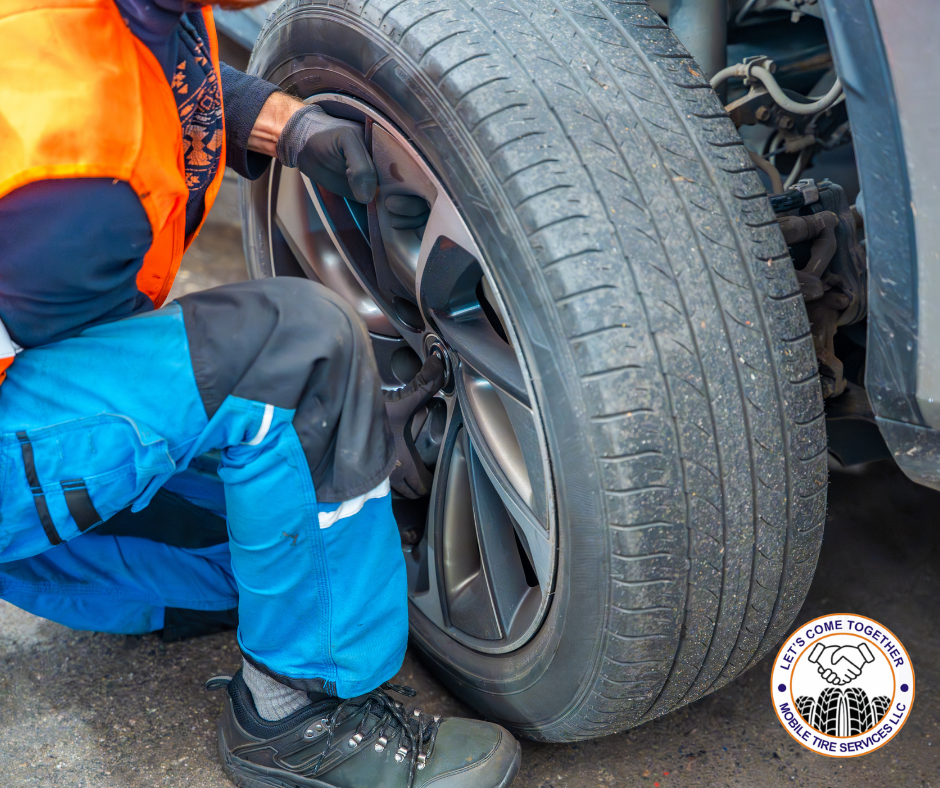 Close-up of a damaged tire being replaced