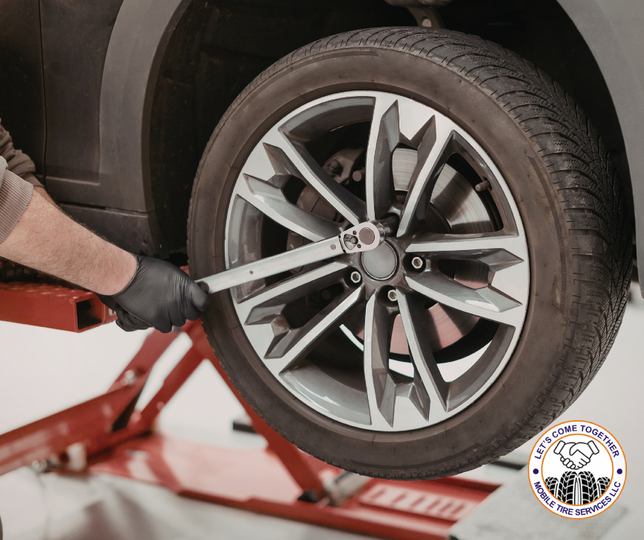 Close-up of a damaged tire being replaced