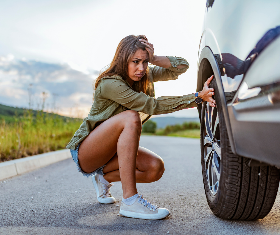 stress woman with a flat tire